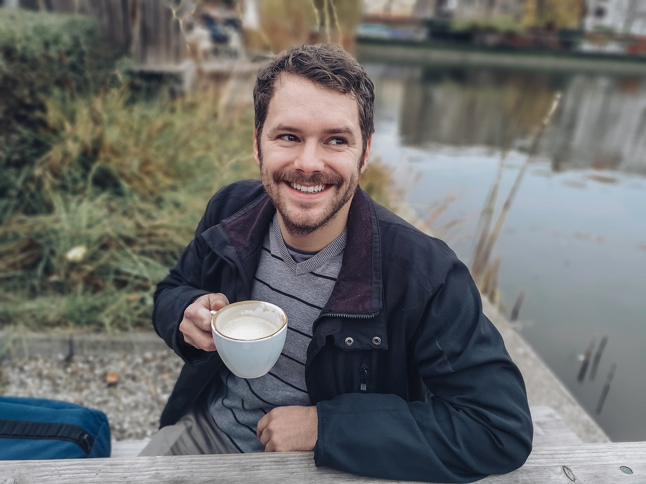 man drinking a coffee outside