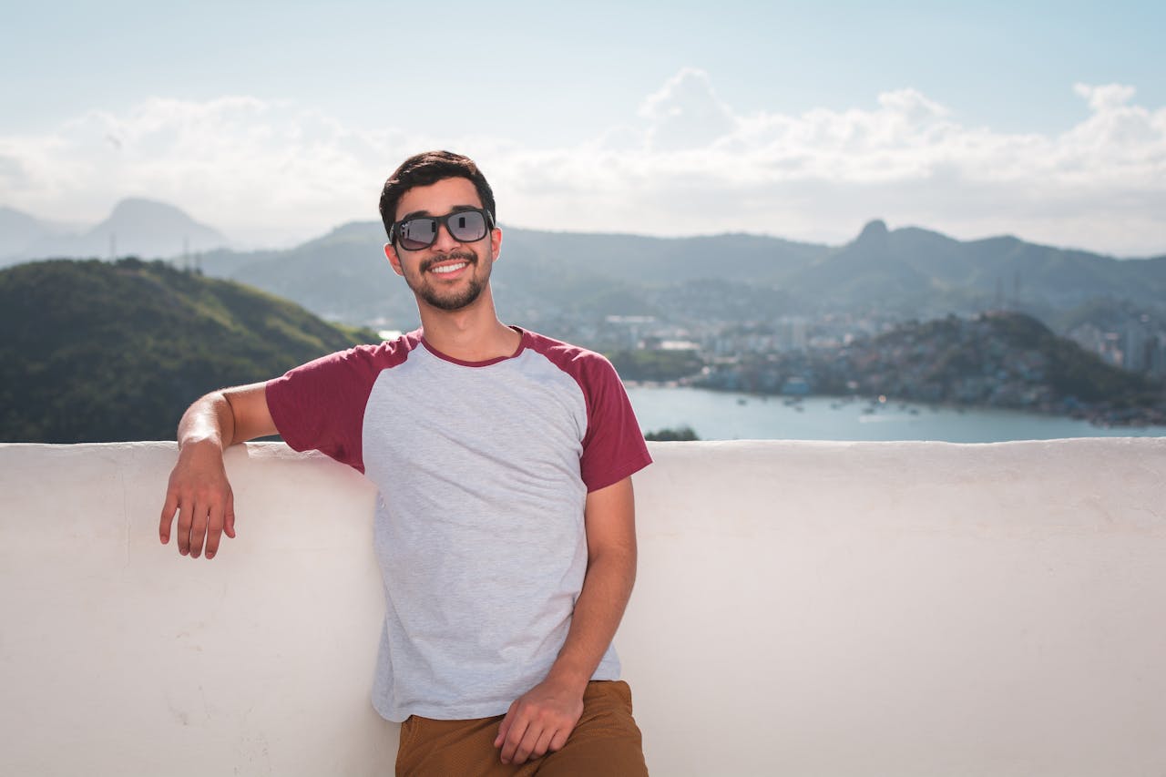 a man who might have erectile dysfunction poses for a picture with his hand near his groin