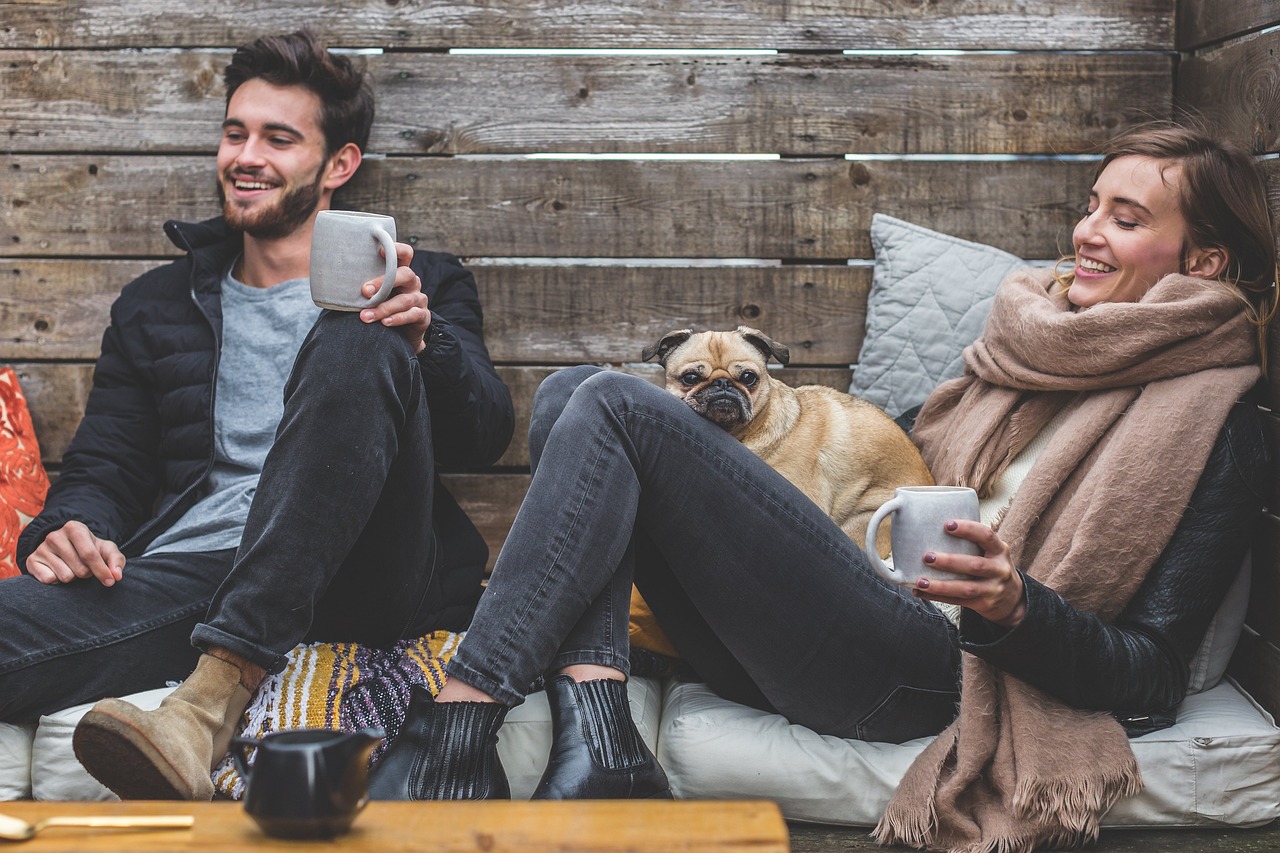 happy people sitting with dog