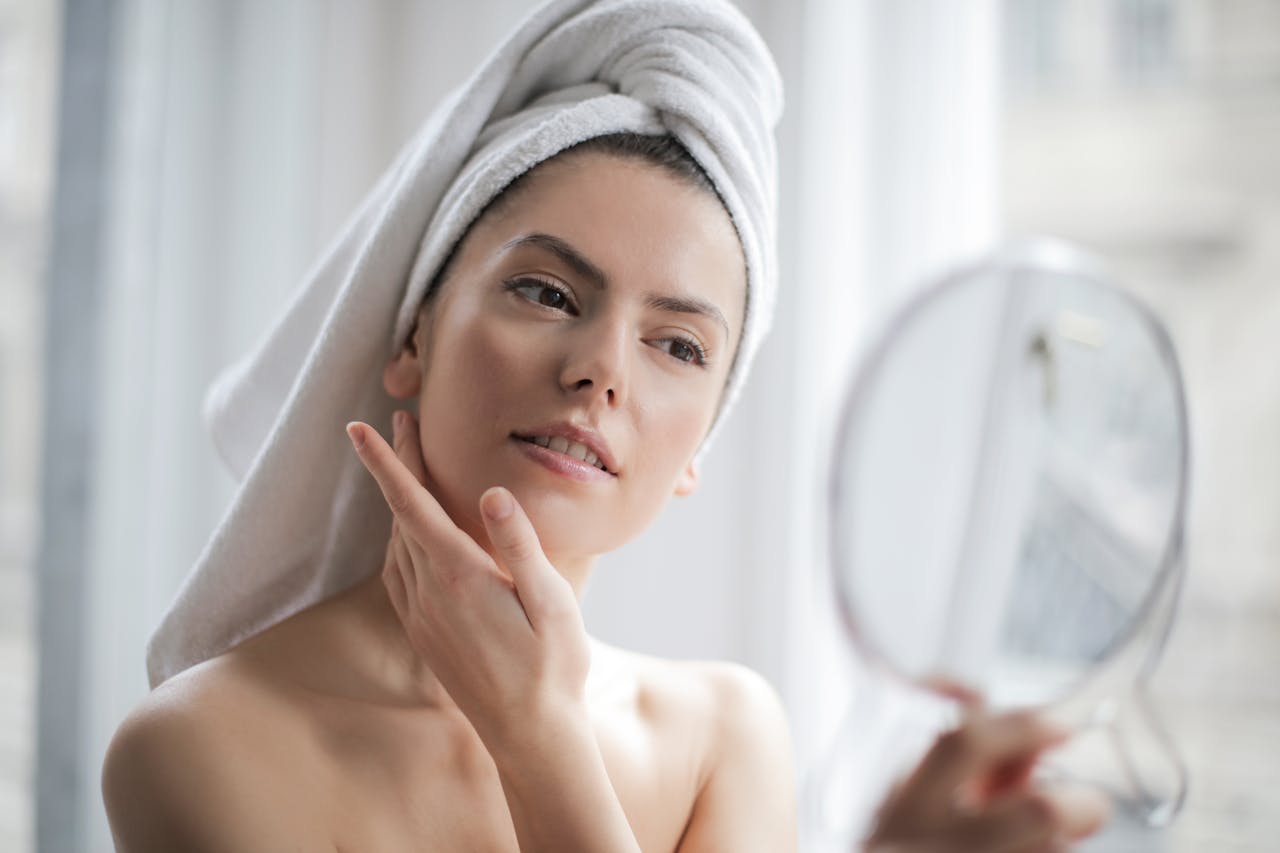 woman applying skin tightening cream