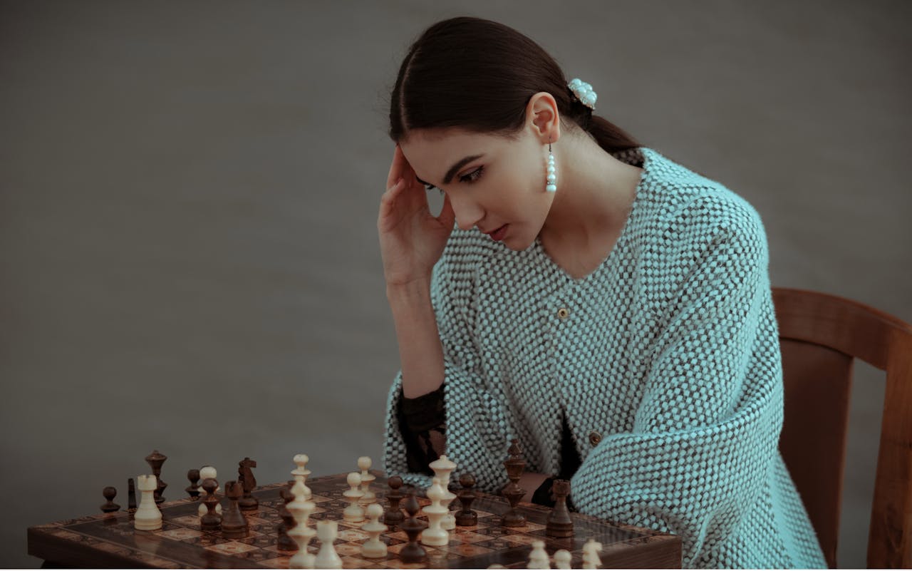 woman using her brain energy to play chess